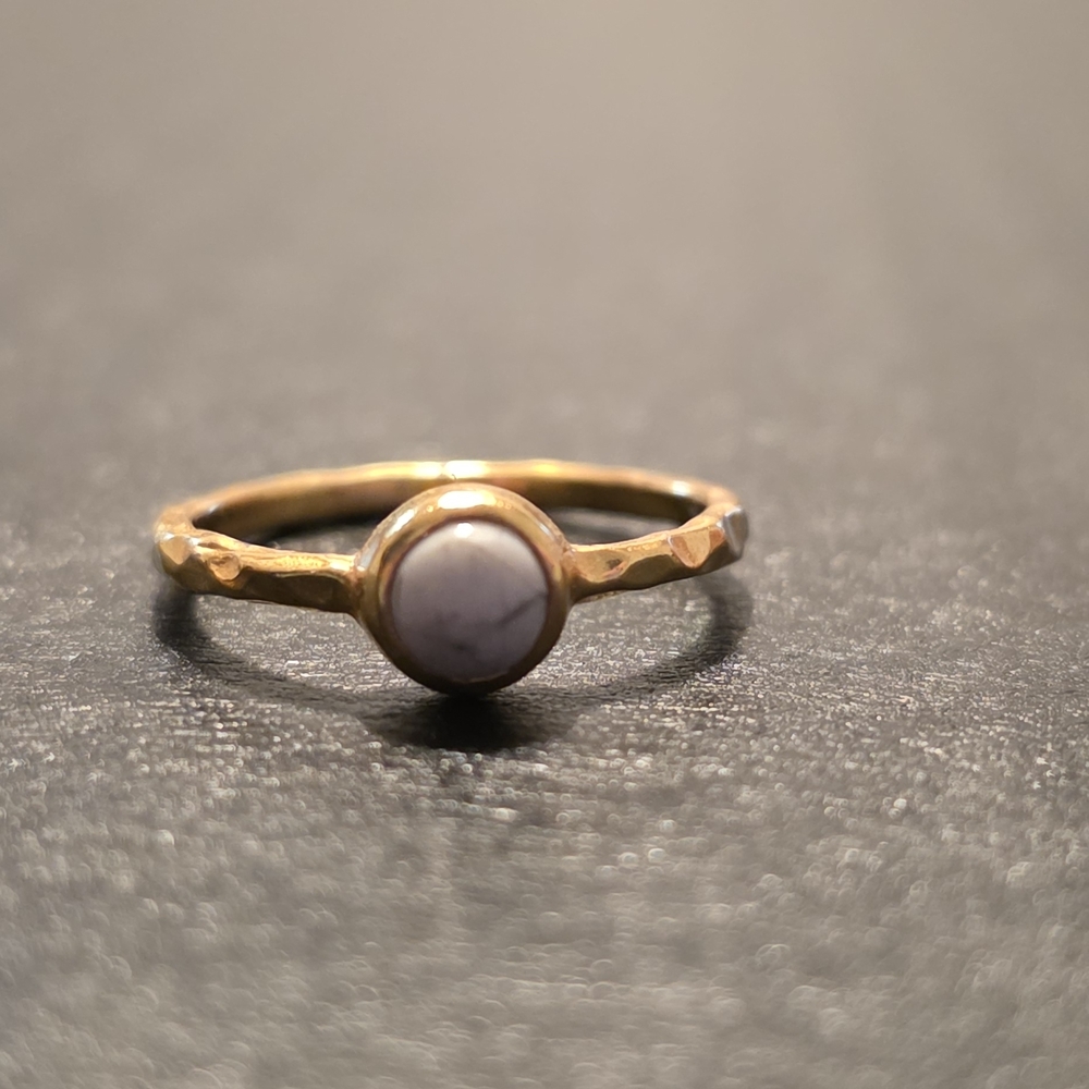 Elegant Gold Women's Ring with White Accent Stone.